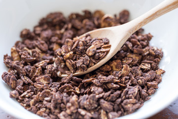 granola in wooden spoon