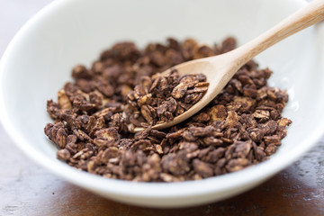 granola in wooden spoon