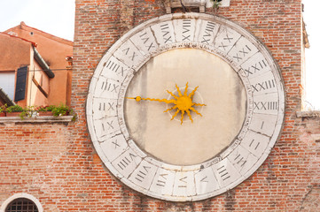 Fototapeta na wymiar Old clock of the Church in Venice