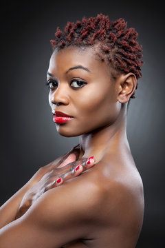 Black beauty with short spiky hair Stock Photo | Adobe Stock