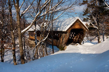 Snow covered Henniker Bridge in New England. The bridge is located near New England College in New Hampshire.