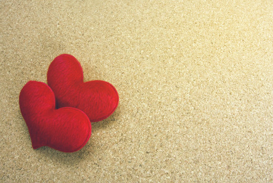 two red heart on wooden background
