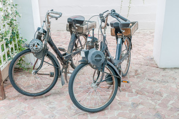 Fototapeta na wymiar Two vintage motorised bicycles
