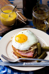sandwich with sauerkraut , ham and fried eggs
