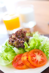 Fresh vegetable salad in white plate.