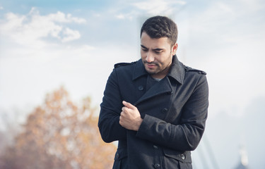 Young man in a coat