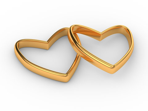 Two gold hearts rings isolated on white