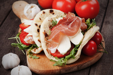 Piadina romagnola with prosciutto and mozzarella cheese