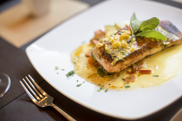 Grilled salmon with sauce and herbs