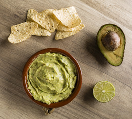 Guacamole with avocado, lime, tomato, and cilantro with tortilla