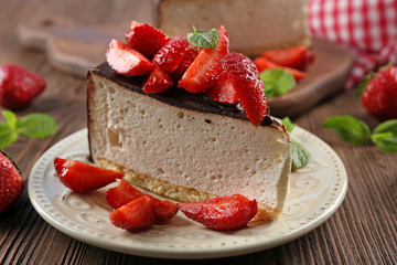 Delicious cheesecake with berries on table close up