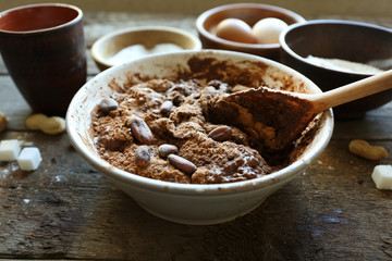 Preparing dough for chocolate pie on table close up