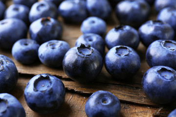 Fresh blueberries on wooden table, closeup
