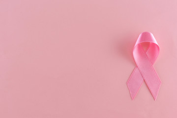 Satin ribbon sign on pink background