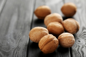 Walnuts on a black wooden table