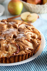 Homemade apple cake on blue wooden table