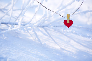 red heart on a snowy background