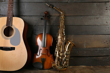 Musical instruments on wooden background