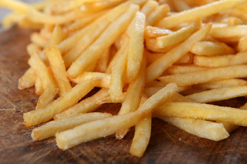 French fried potatoes on cutting board