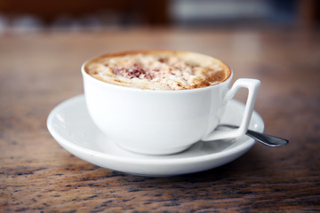 Cup of tasty cappuccino in cafe