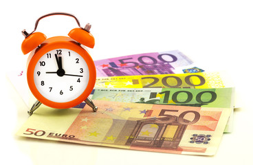 Alarm clock with paper euro money 50, 100, 200, 500