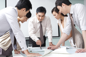 Fototapeta premium Business Executive Explaining Business Plan to Business Team