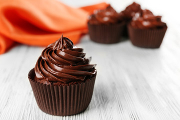 Chocolate cupcakes and napkin on table