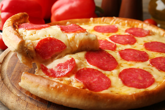 Hot tasty pizza with salami, close up