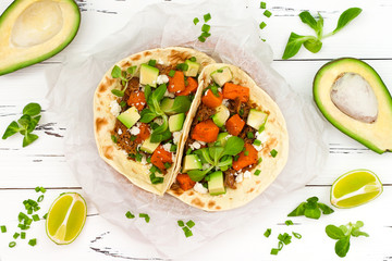 Mexican tacos with meat, sweet potatoes and cotija cheese