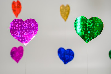 Colorful hearts hanging on the line