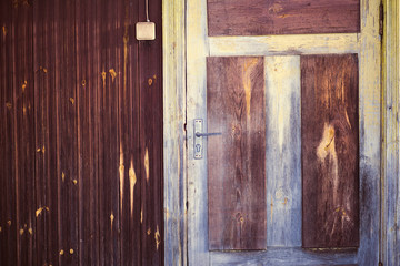 entrance with door handle of an old wooden house