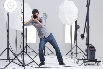 Photographer taking picture in studio