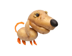 Naklejka premium Dog made of potatoes, carrot and olives