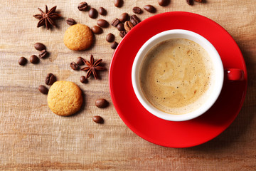 Cup of coffee on wooden table background