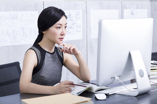 Young woman working in office