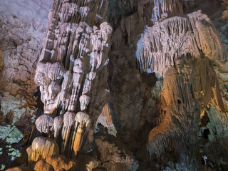 Colorful cave in Ha Long bay Vietnam and a hole to outside.