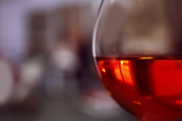 Glass of wine on blurred background