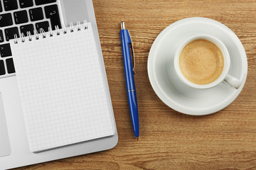 Empty  notebook on laptop keyboard, on light background