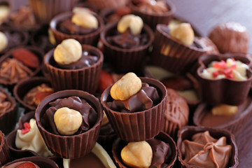 Delicious chocolate candies background, close up