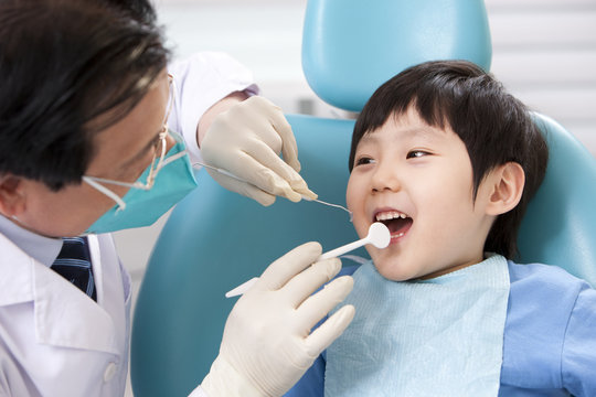 Doctor examining patient teeth