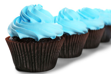 Delicious cupcakes isolated on white background