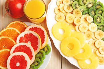 Fruits on wooden background. Healthy eating concept.
