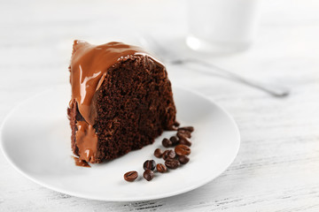 Piece of chocolate cake on a table, closeup