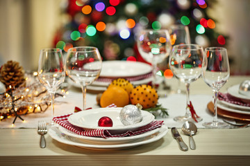 Obraz na płótnie Canvas Christmas table setting with holiday decorations background