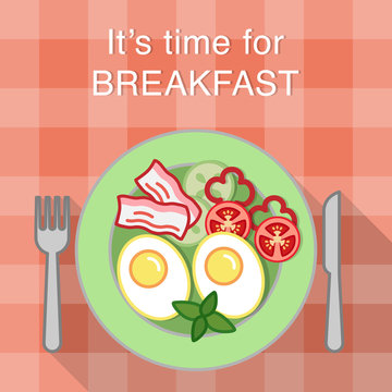 Breakfast table with fried eggs, bacon and vegetables on a plate, knife and fork
