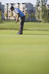 Golfer putting on the Green
