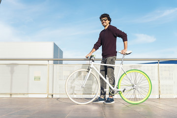 Handsome young man with fixed gear bicycle.
