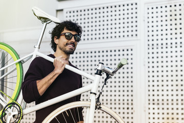Handsome young man with fixed gear bicycle.