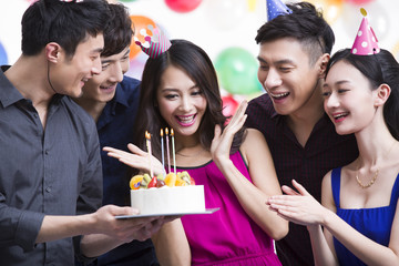 Young adults having a birthday party