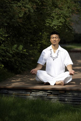 Fototapeta premium Man Meditating Outdoors
